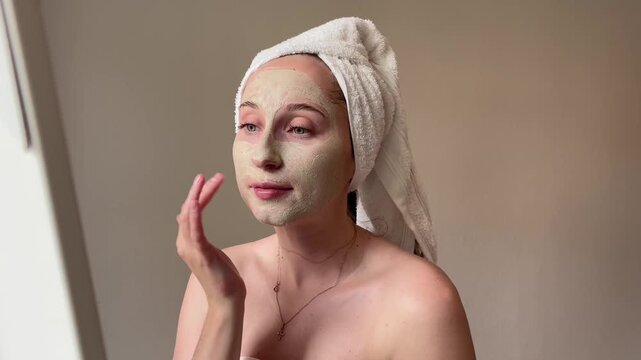 Closeup face of smiling woman applying cream on skin. Shot with RED camera in 4K. High quality FullHD footage