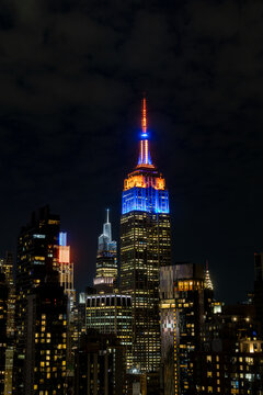 New York, NY- May 21 2026: Manhattan skyline with the Empire State Building in New York Knicks colors