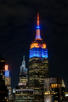 New York, NY- May 21 2026: Manhattan skyline with the Empire State Building in New York Knicks colors