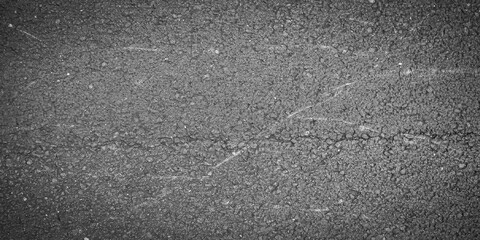 Fototapeta premium Dark gray scratched asphalt road texture with cracks and rough granular surface grunge vector illustration.