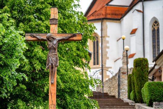 Wooden crucifix with Jesus Christ near church in Svaty Jur Slovakia