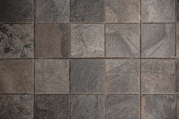 Fototapeta premium Rustic square slate floor tiles texture with grout lines. Grunge grey and brown stone background for architectural design.