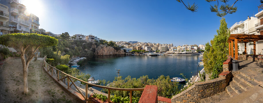 Agios Nikolaos on the island Crete, Greece, with Lake Voulismeni. Unidentifiable People in the distance