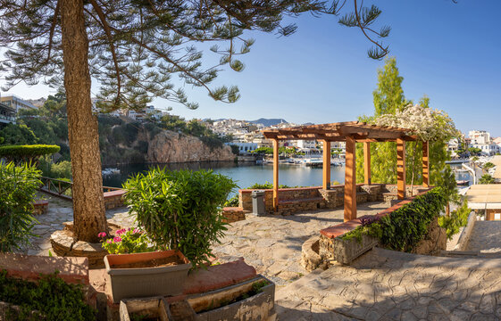 Agios Nikolaos on the island Crete, Greece, with Lake Voulismeni. Unidentifiable People in the distance