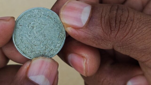 Hand Displaying 1981 Mexican 5 Pesos Coin Close Up Video Frame