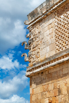 Mayan architecture in Puuc style with hooked noses representing rain god Chac, Uxmal, Yucatan, Mexico.