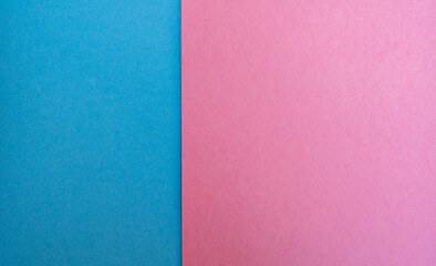 Fototapeta premium Fondo minimalista de papel azul y rosa dividido en dos colores pastel con textura suave