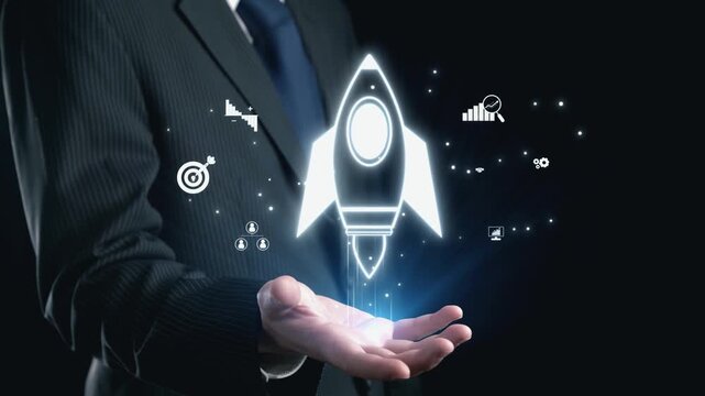 A businessman holds a glowing rocket symbolizing innovation and growth, surrounded by technology icons, reflecting ambition and strategic vision in the business world. Qubit