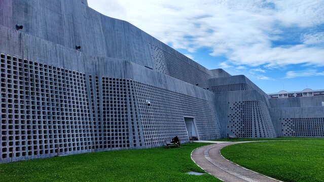 Naha, Japan - May 26, 2026. Road, Grass and Building of Okinawa Prefectural Museum