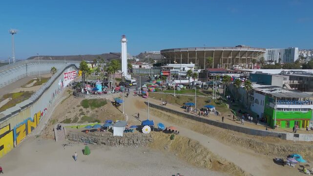 Aerial Flight of Border Wall Infrastructure and Coastal Landmarks at Playas de Tijuana, Mexico.