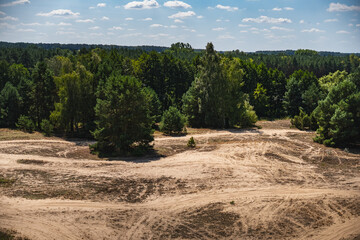 a landscape with sandy terrain used for quad biking and motocross © michal812