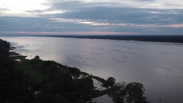 Santa clara de ojeal amazon river sunset scenery in iquitos peru