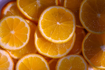 Fototapeta premium Bright, juicy orange slices arranged in a vibrant display ready for a refreshing snack or dessert