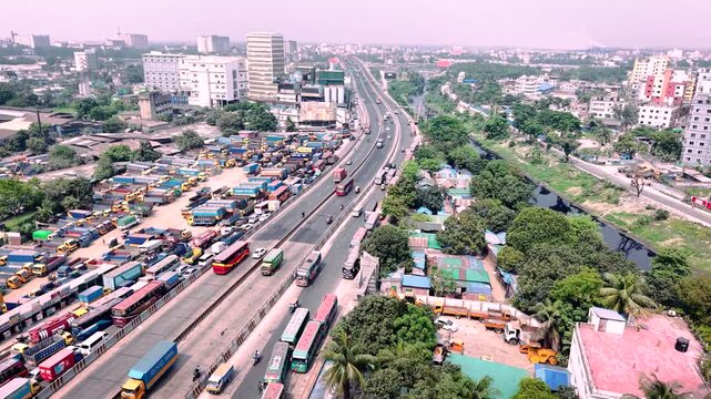 Aerial Drone View of Busy Highway Network and Expanding Urban Landscape