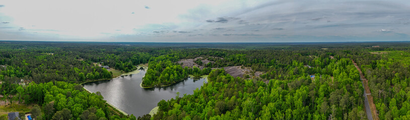 Obraz premium Panoramic aerial drone view of rural landscape and waterways near Heggie's Rock Georgia USA