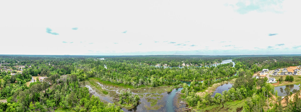 Panoramic aerial drone view of river and rural residential landscape near Bettys Branch, Georgia USA