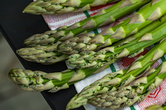 Fresh green asparagus on towel