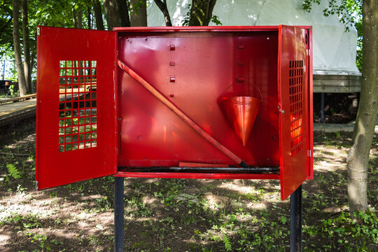 Red fire safety cabinet outdoors