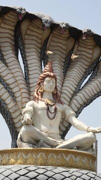 Seated Lord Shiva Statue Protected by Sacred Serpent Canopy, mahakal corridor, Ujjain Shiva Shri Mahakaleshwar Jyotirlinga Temple