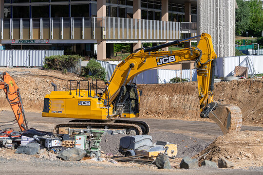 Laxou, France - June 13th 2026 : View on a yellow crawler excavator JCB 370X NLC for earthworks on a construction site before the construction of a building.