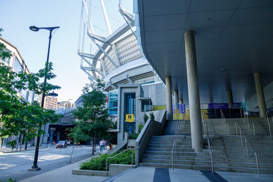 The exterior of BC Place stadium, its cable-supported roof rising above concrete steps and columns at Entrance 6, a World Cup venue in downtown Vancouver.