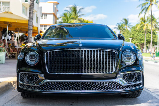 Miami, Florida, USA - July 27, 2025: Bentley Flying Spur 2020 luxury sedan car. Luxury car Bentley Flying Spur. Car Bentley Flying Spur parked outdoor. Black car, front view.