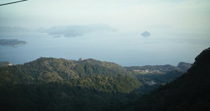 Aerial View Of Forest Covered Islands and Sea In Hiroshima, Japan - Tracking shot