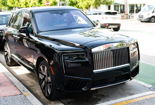 Miami, Florida, USA - July 27, 2025: Car Rolls Royce Cullinan parked outdoor. Black SUV car, corner view. Rolls Royce Cullinan 2025 SUV car. Luxury SUV car Rolls Royce Cullinan