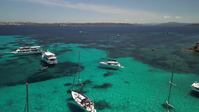 Wyspa Święta Maria archipelag La Maddalena - Sardynia - Włochy
plaża, morze , g&oacute;ry, yacht i skały nagrane dronem w wysokiej jakośći. Piękna mała wyspa obok Sardynii