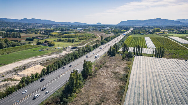 Aerial view of Autoroute A7 crossing agricultural fields in the Rh&ocirc;ne Valley, Southern France