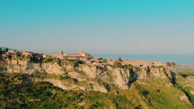 Approaching the historic village of Gerace in Calabria, aerial summer view
