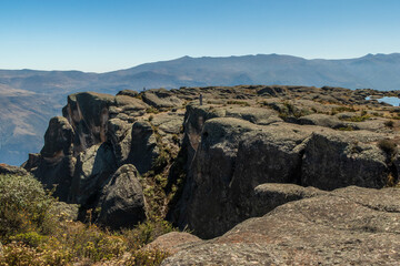 Fototapeta premium Hikers exploring the granite cliffs of Marcahuasi in the Peruvian Andes