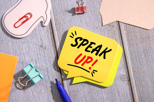 Speak Up Concept on Colorful Speech Bubble Sticky Notes Communication and Feedback Message.