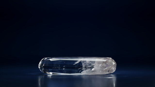Transparent, faceted quartz-like crystal oblong shape on dark, copy space minimalist background
