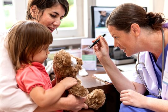 Pediatric checkup with caring interaction.