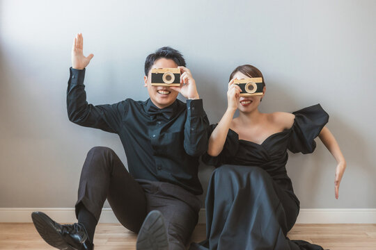 Bride and groom having pre-wedding photos taken at a studio.