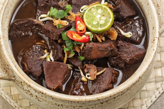 Rawon is a typical Indonesian dish originating from Ponorogo, East Java, which is a black meat soup with a mixture of special spices using kluwek.