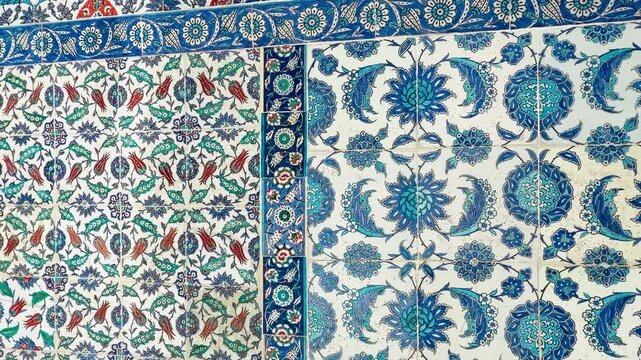 Mesmerizing underglaze painting on authentic Iznik quartz tiles with cobalt blue floral patterns at Eyup Sultan Mosque, showcasing magnificent traditional Ottoman artisan pottery and unique art.