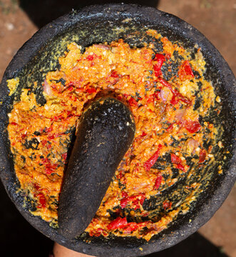 Traditional Indonesian Sambal Chili Paste in Stone Mortar