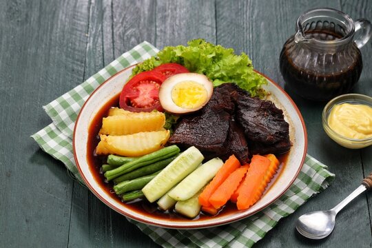 Selat Solo, a classic Javanese beef salad and soup from Surakarta, Central Java, Indonesia. Served with tender beef, boiled vegetables, potatoes, eggs, lettuce, and a sweet savory broth