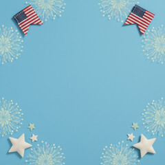 Obraz premium Light blue background with patriotic border featuring american flag pennants and fireworks for an independence day greeting card, holiday social media and marketing banner
