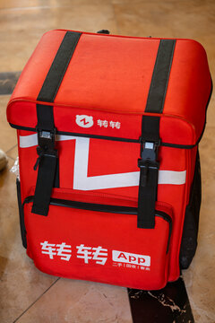 ZHONGSHAN China-May 31 2026: Bright red Zhuanzhuan second-hand recycle consign service canvas backpack.