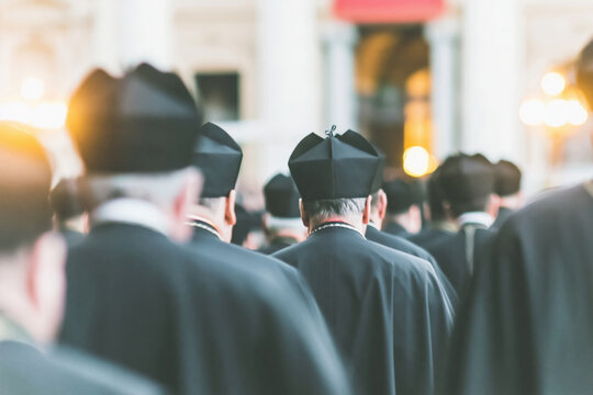 Group of clergymen in dark ceremonial robes walking in a formal procession toward a classic building entrance for religious editorial, historical study and news