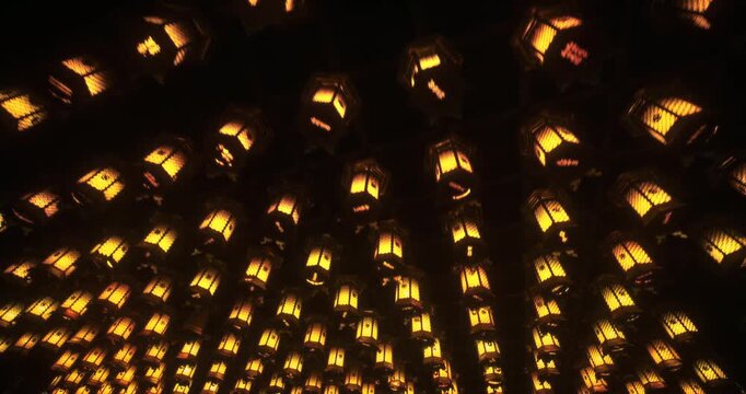 Hundreds of Glowing Traditional Lanterns Hanging in Dark Japanese Interior - Low, Steady Cam Shot