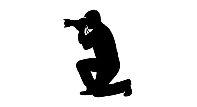 Man Kneeling and Aiming Camera.