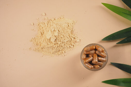 Health supplements on a light surface with plants