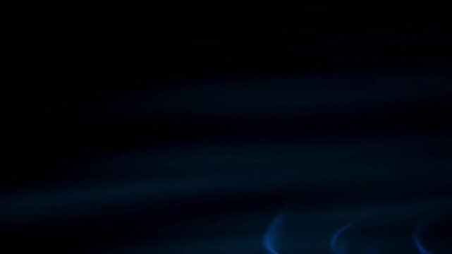 ethereal blue flames dancing in the dark, a captivating visual effect