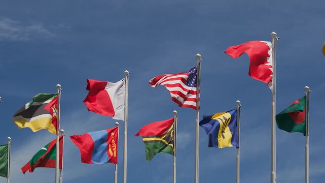 National flags of USA, Bahrain, Bangladesh, Barbados, Maldives, Mongolia, Mozambique, Vanuatu and other countries flying at Olympic Park in Seoul, South Korea