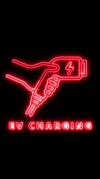 Electric vehicle charging station sign with neon red glow