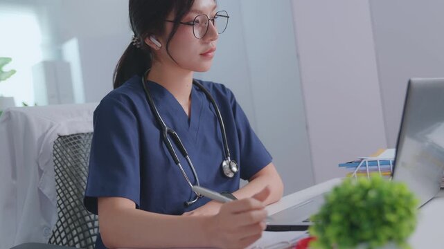 Doctor entering electronic medical records. Medical, asian woman working with computer in medical consultation at hospital. which are recording diagnoses and patient symptoms. Healthcare and medicine
